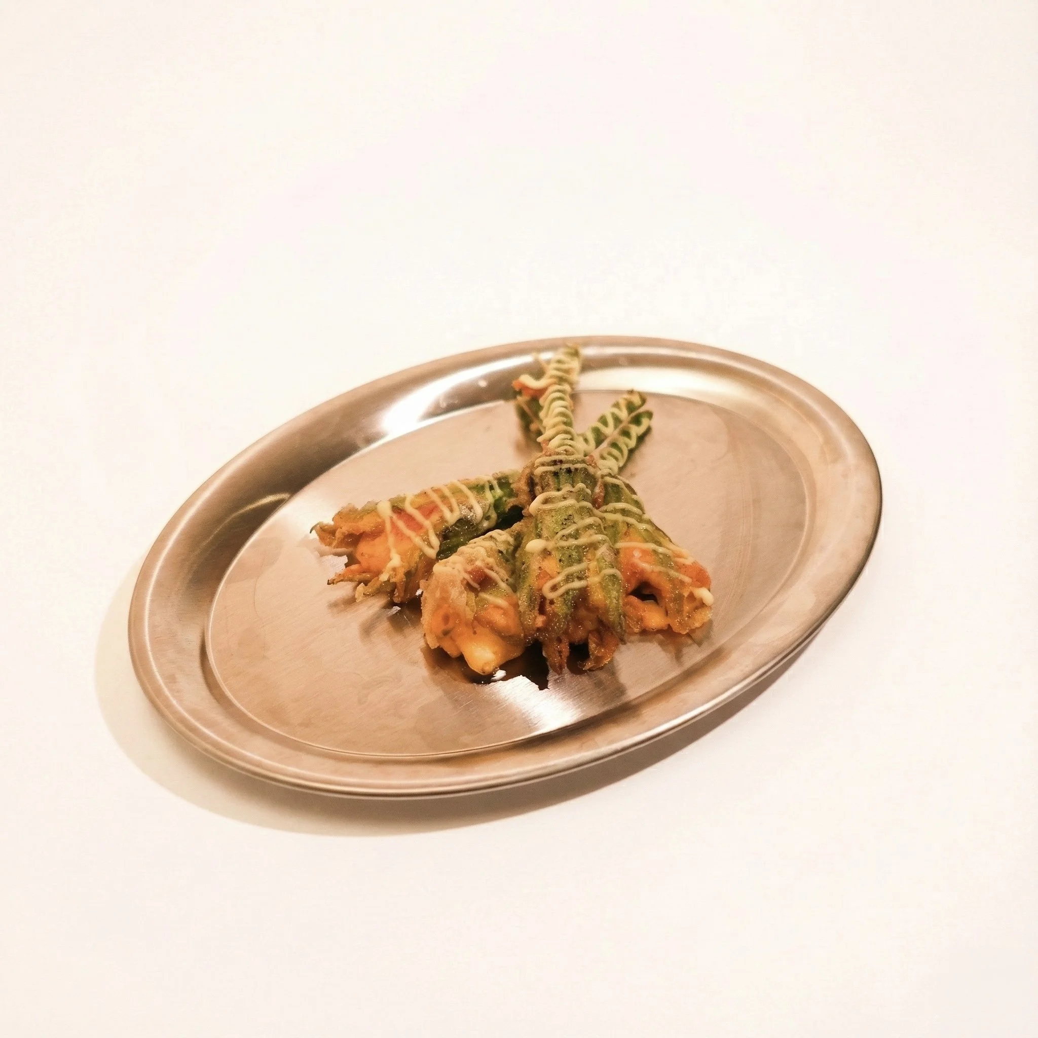 ZUCCHINI BLOSSOM WITH POTATO-UNI CREAM · Crisp blossom filled with silky potato, crab and uni cream · 340