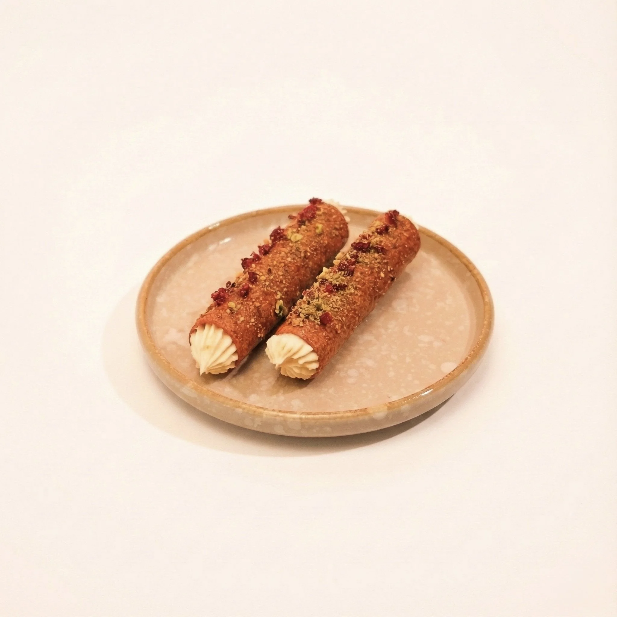 CINNAMON SUGAR CANNOLIS · Fried cannolis rolled in cinnamon sugar and filled with cream · 180