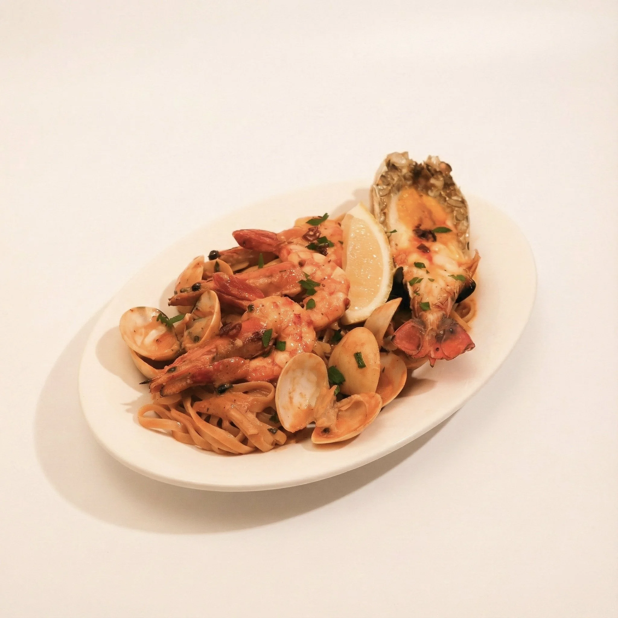 AL FRESCO SEAFOOD LINGUINE · Linguine tossed with a spicy seafood bisque and whole river prawn & uni · 1,280