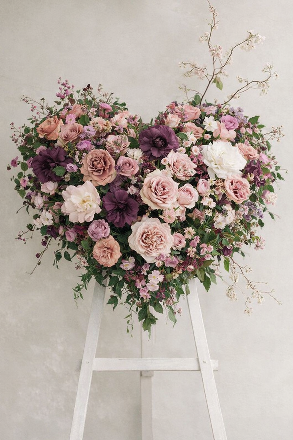 Funeral heart wreath shades of pink flowers