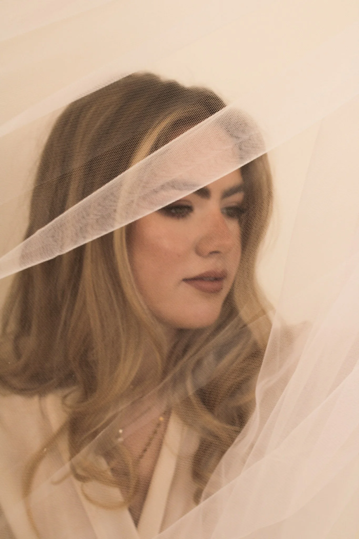 Luxury bridal makeup experience with veil and soft timeless bridal finish