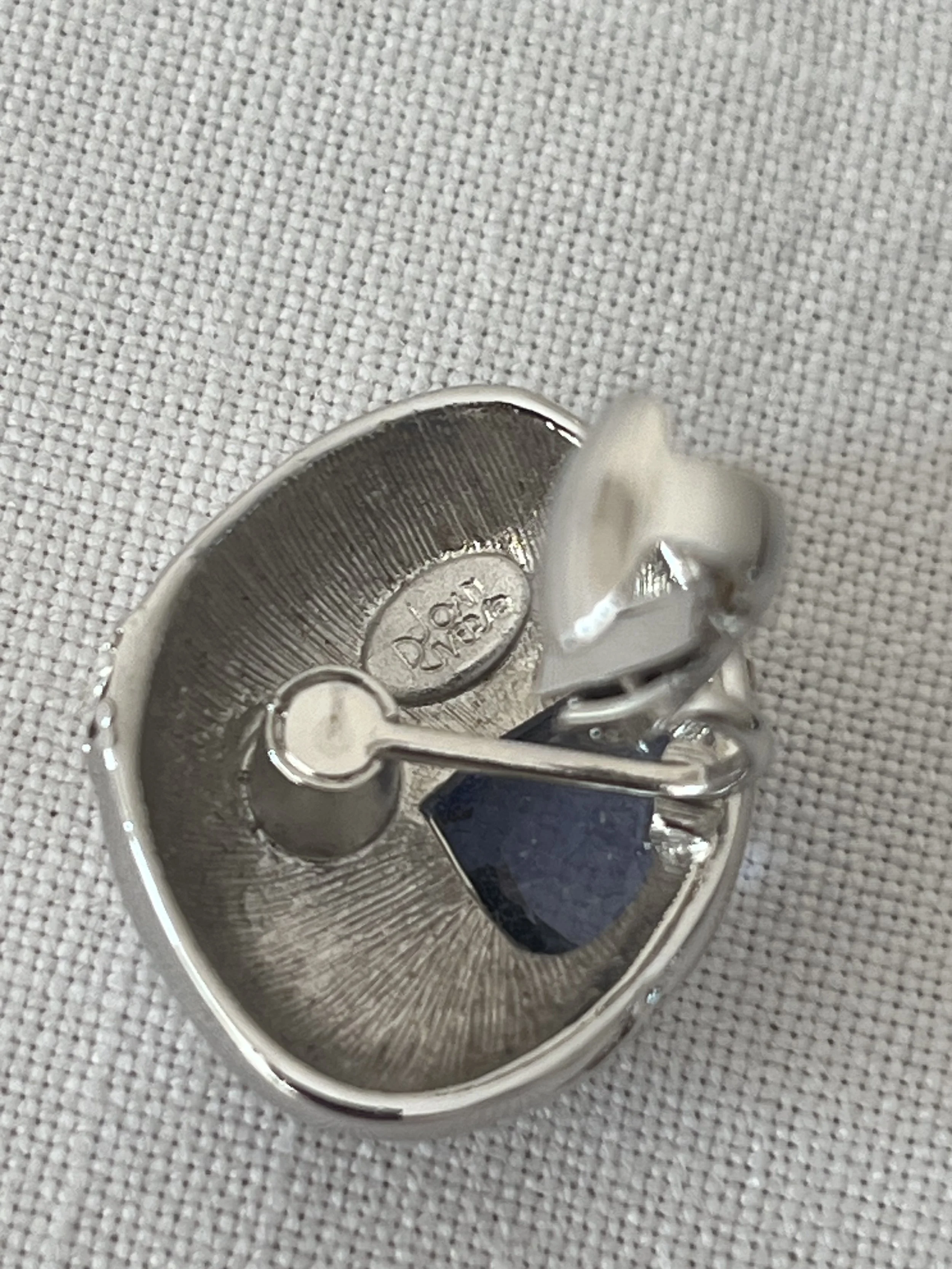 1990s JOAN RIVERS SILVER AND PURPLE CLIP-ON EARRINGS CLOSE UP STAMP.jpeg