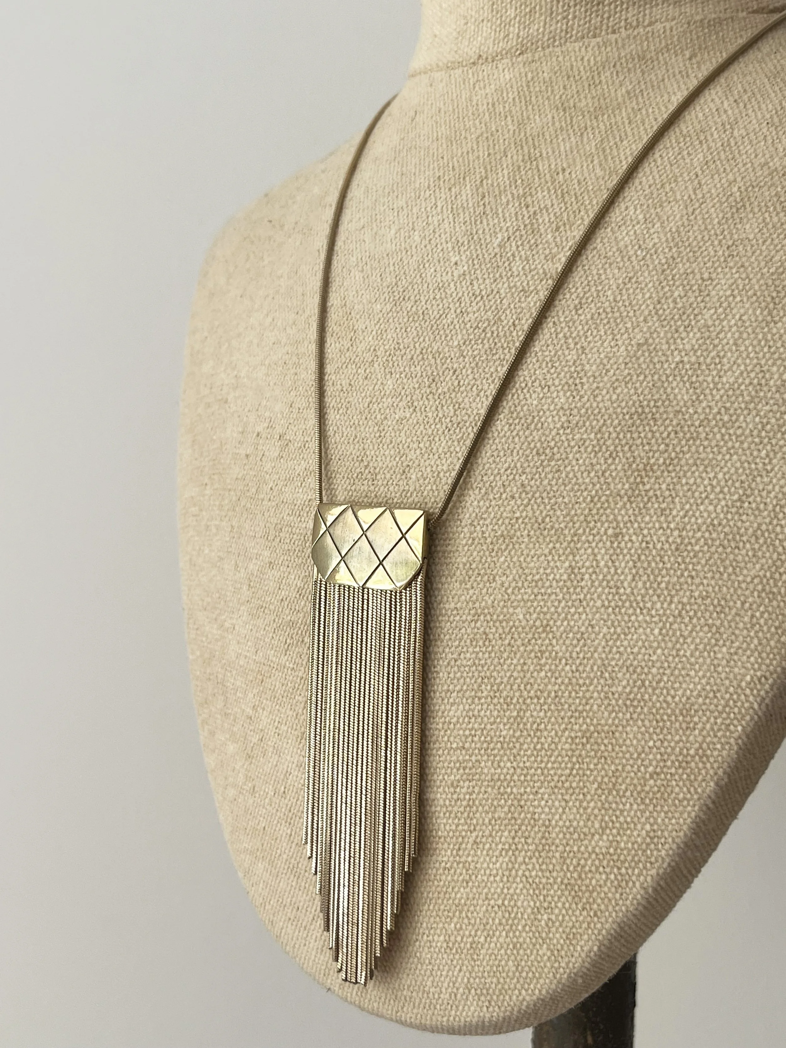 1970s MONET QUILTED FRINGE PENDANT NECKLACE SIDE VIEW.jpeg