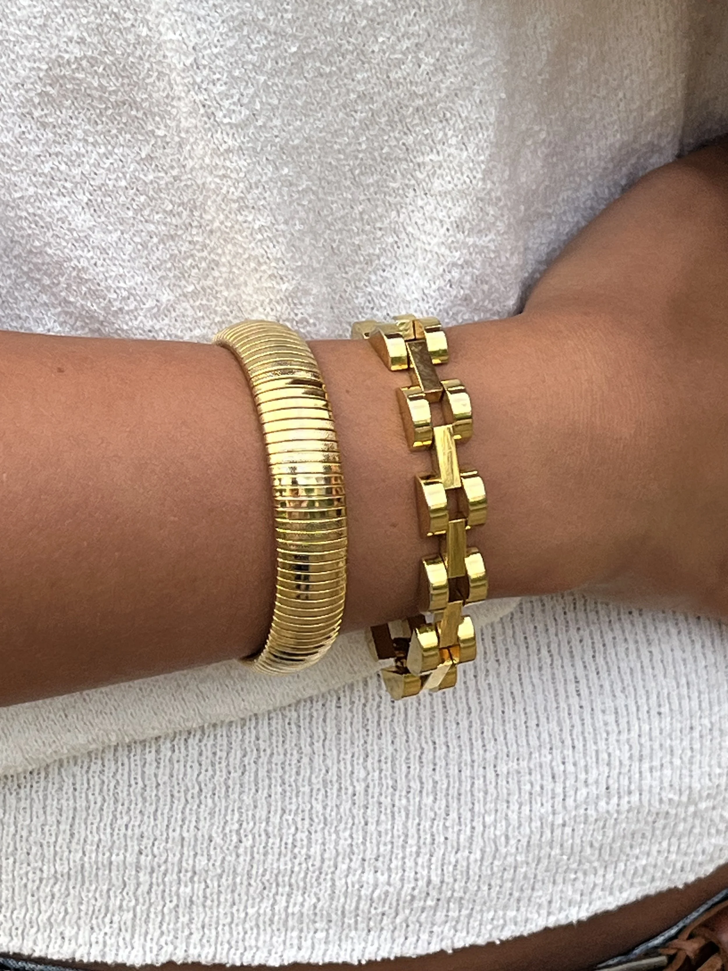 1980s GOLD OMEGA BRACELET STACK ON MODEL.jpg