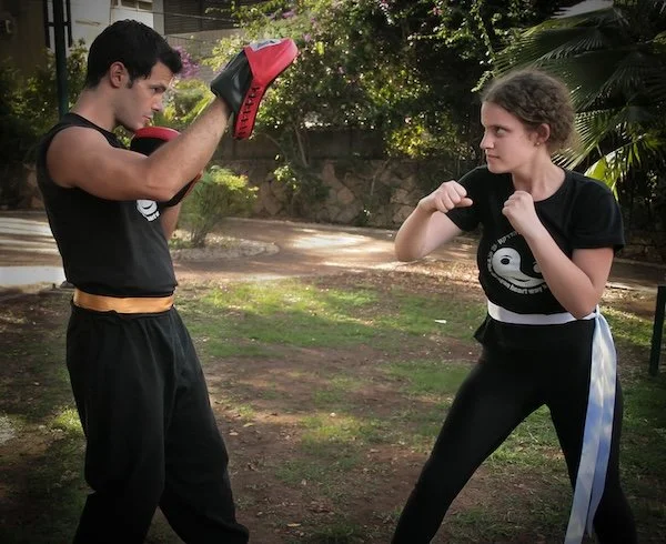 Teens Kung Fu. A teenager practices boxing and self defence - Dragon Heart Kung Fu Berlin