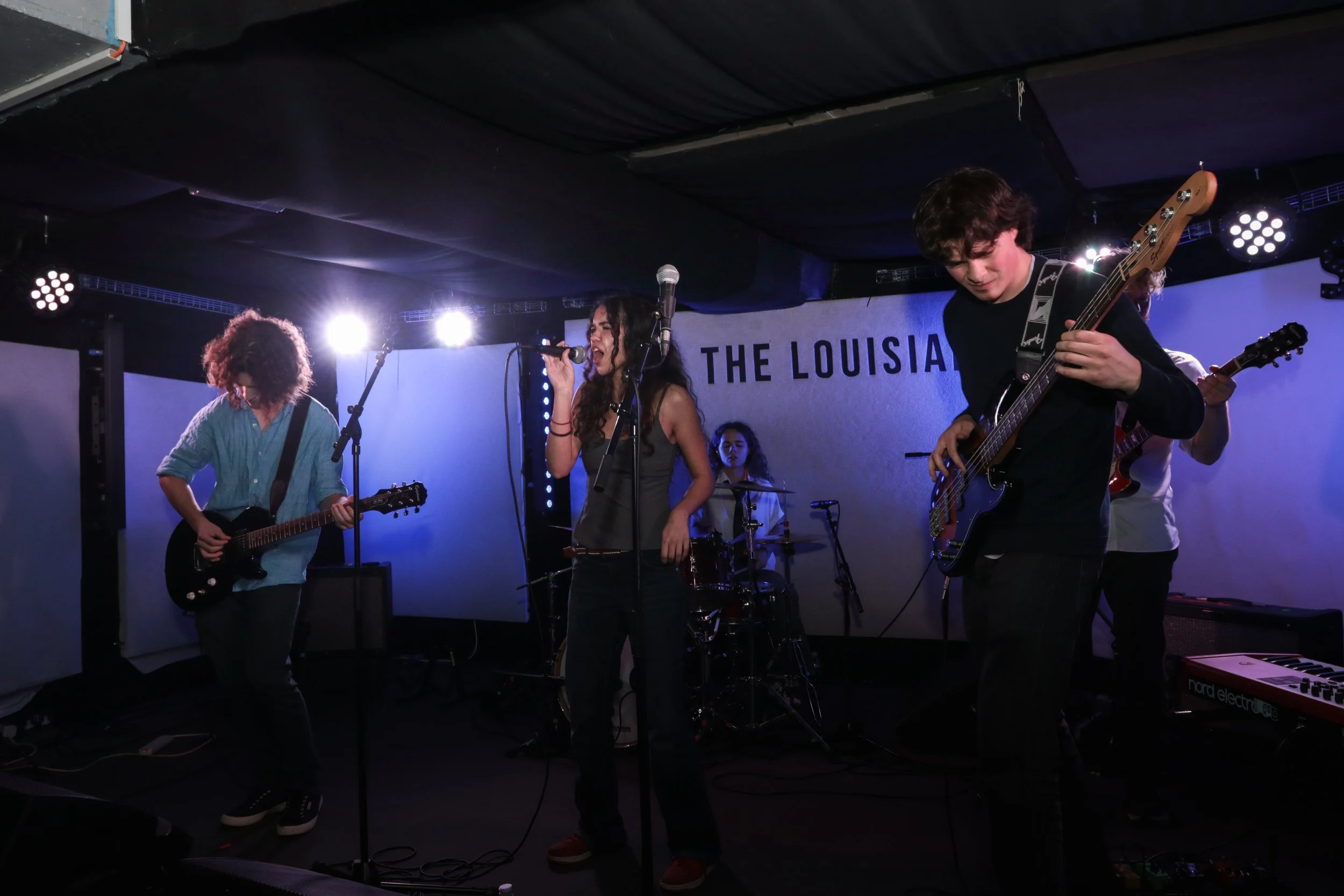 A band performing live on stage at The Louisiana.