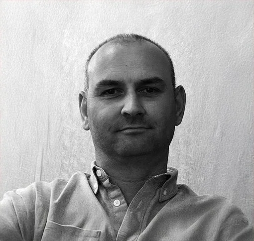 Headshot of Paul Tracey.