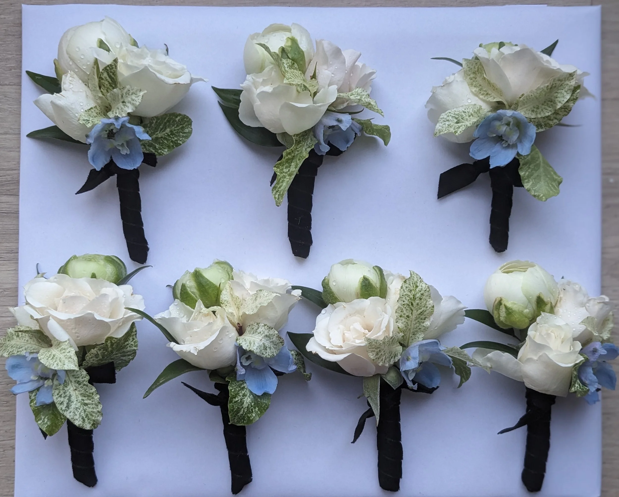 White rose buttonholes