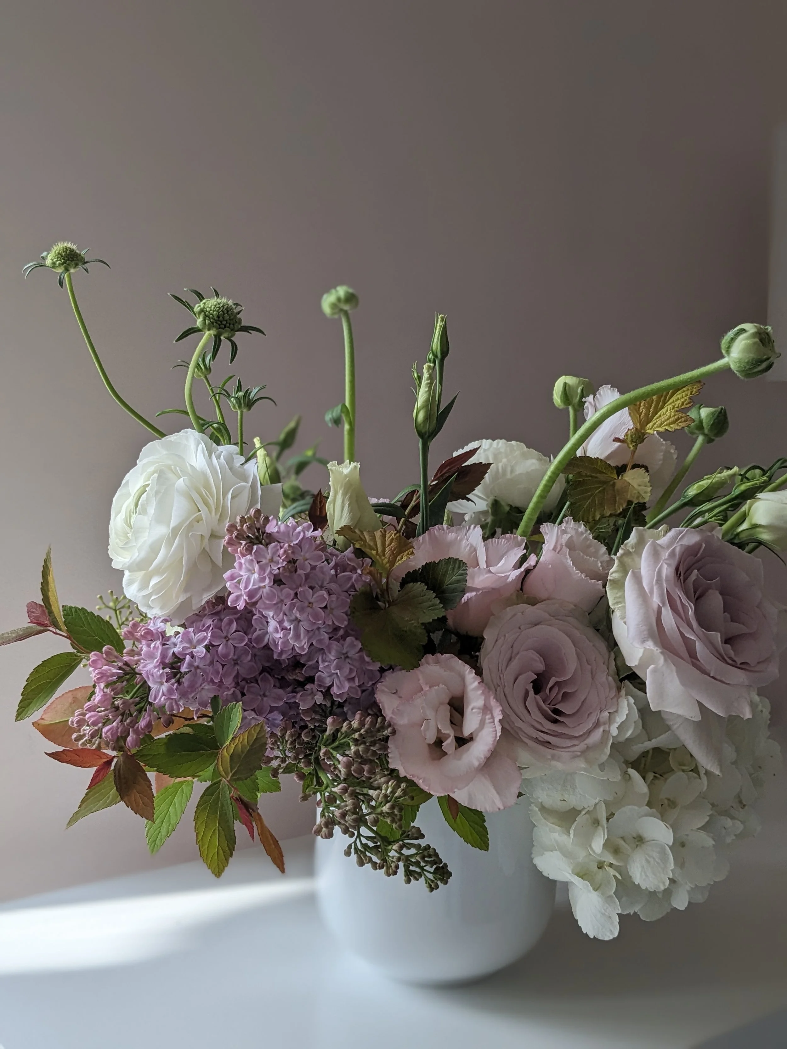 Lilac and white flower arrangement