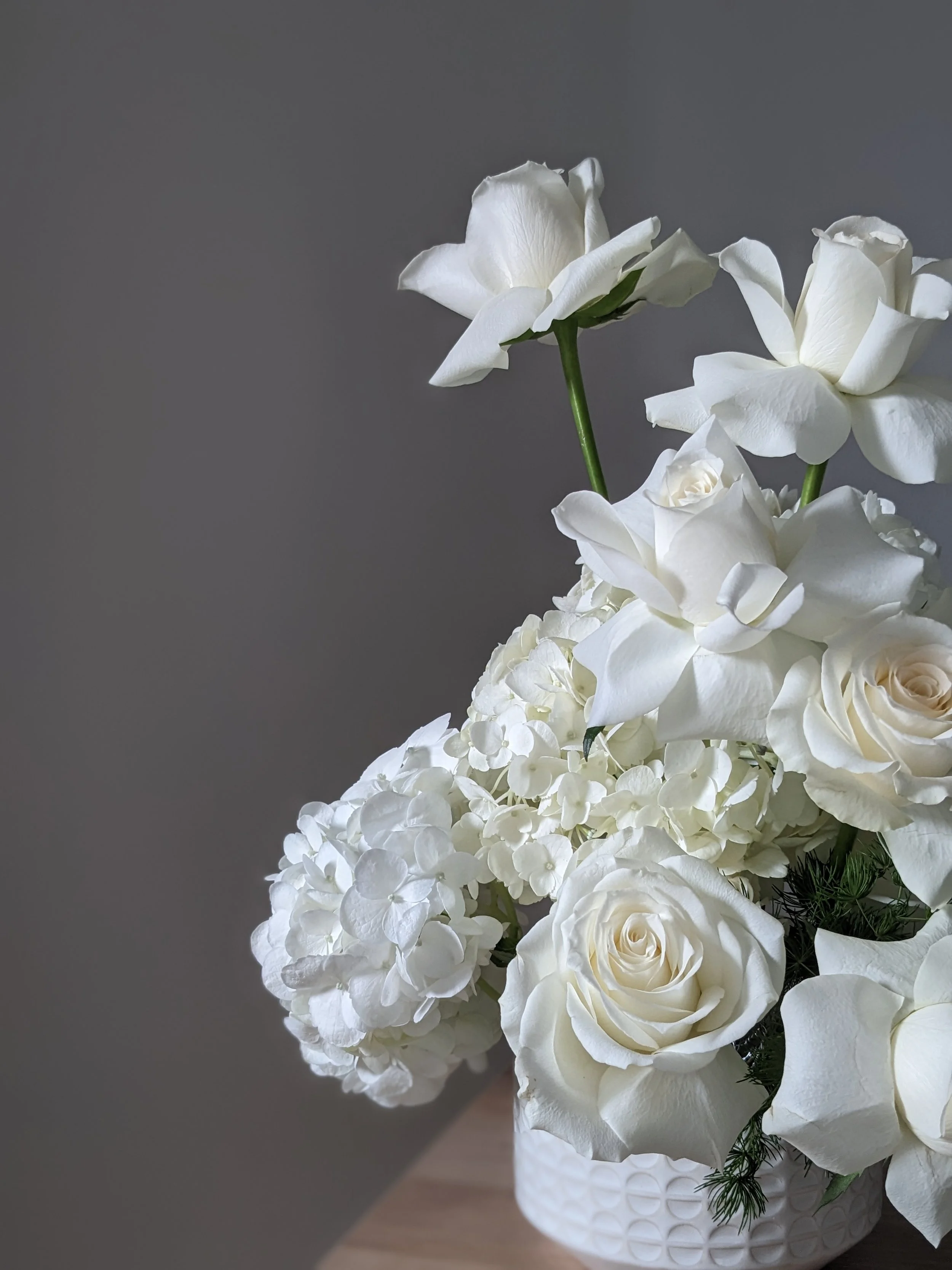 White roses and white hydrangea wedding flowers
