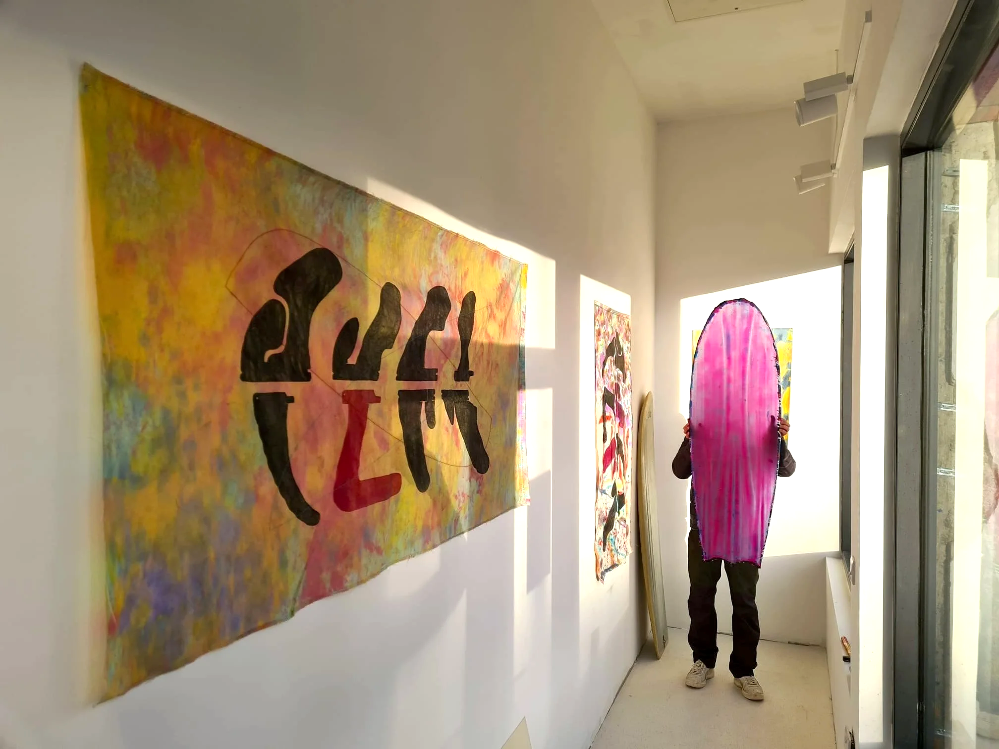 Woodblock print on dyed sailcloth by Ian Jermyn Resin sculpture by Elvis Beetham