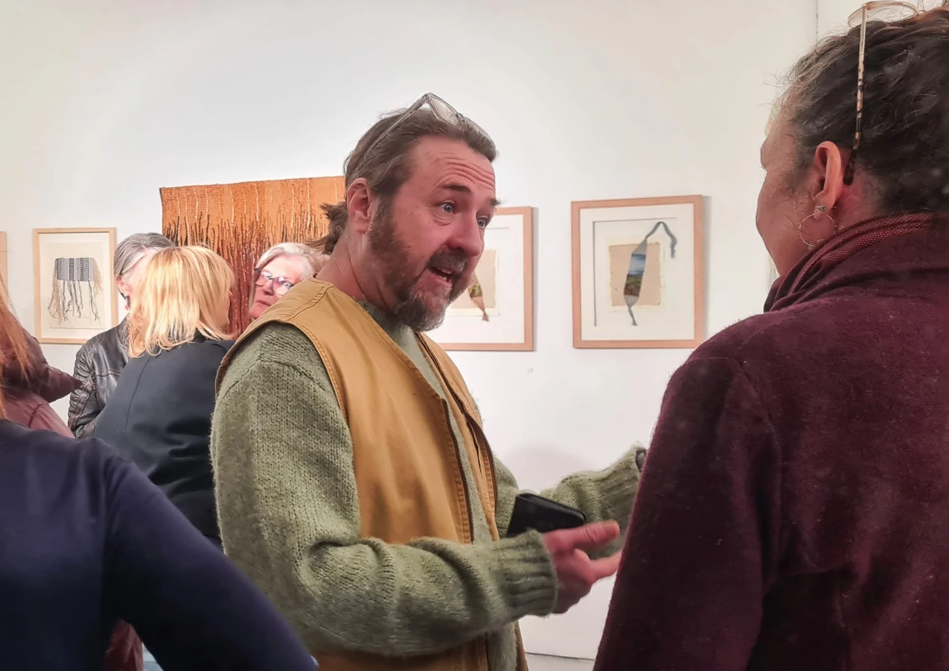 Ken Gunning speaking with Emma Stroud on opening night, Threading Land, Frances Crowe, Scenius Gallery, 2026