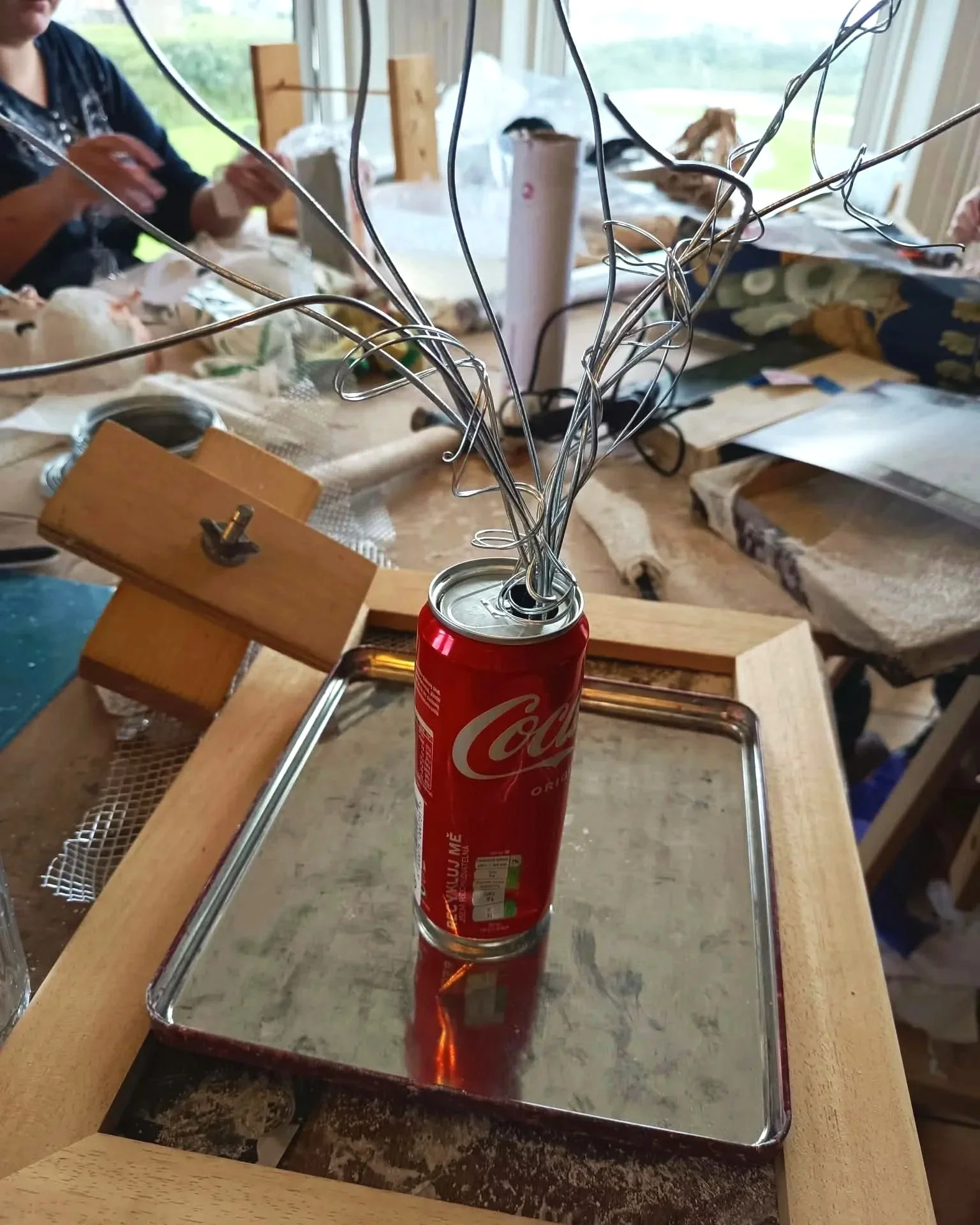 Detail of a wire sculpture rising from a repurposed drinks can, part of The Transatlantic Disportal installation.