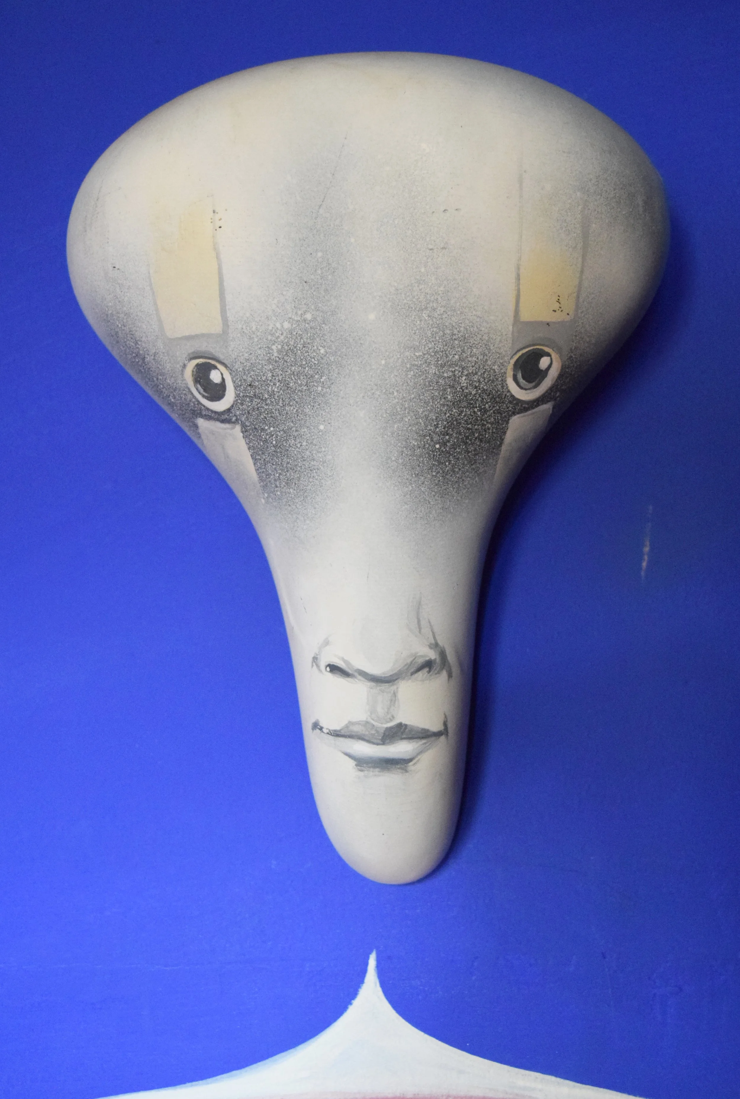 Acrylic on bicycle seat. 