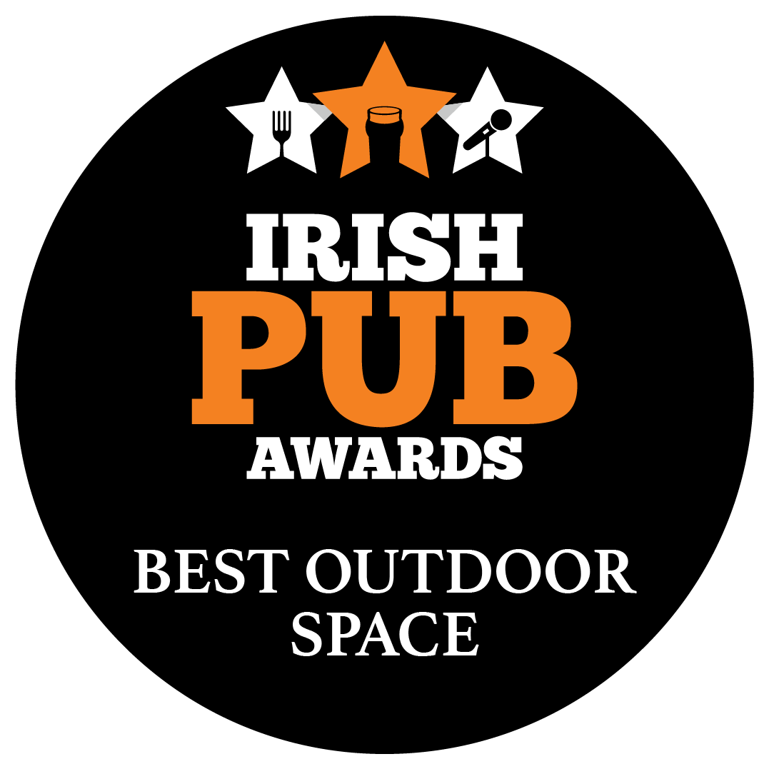 Award badge for Irish Pub Awards for Best Outdoor Space with stars, fork, mug, and microphone icons at the top.