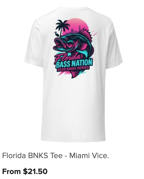 White T-shirt with a colorful graphic design featuring a bass fish, palm trees, and a pink sun, with the text 'Florida Bass Nation 2026 Kayak Series'.