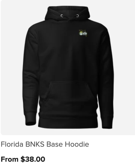 Black hoodie with small emblem of a golf cart on the front left chest area.