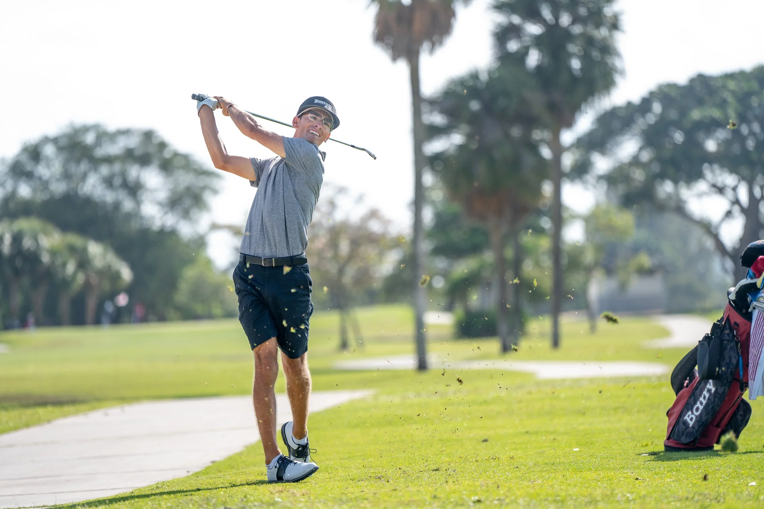 Amani D'Ambrosio golf swing follow-through on golf course in competitive tournament