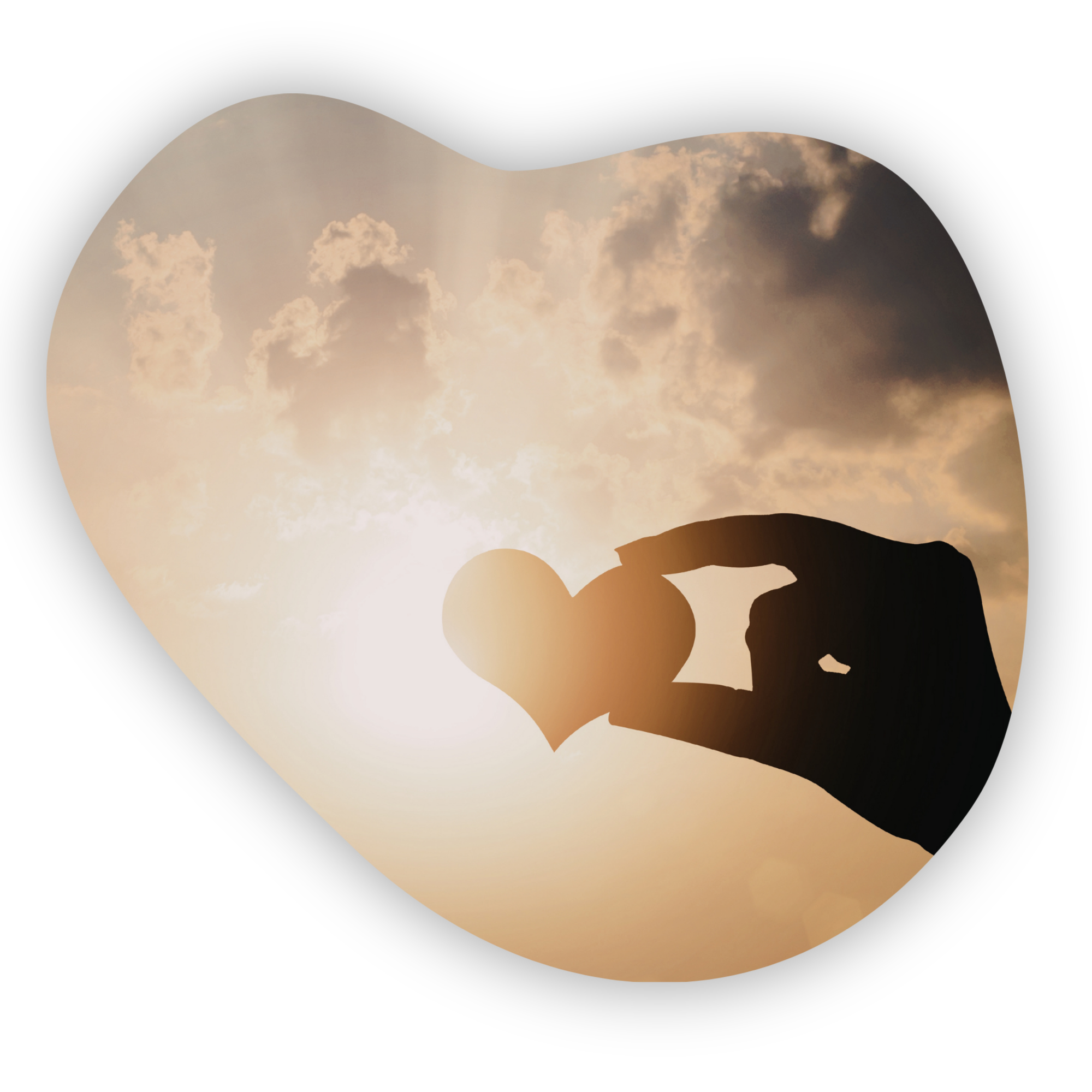 A heart held between fingers in front of sun