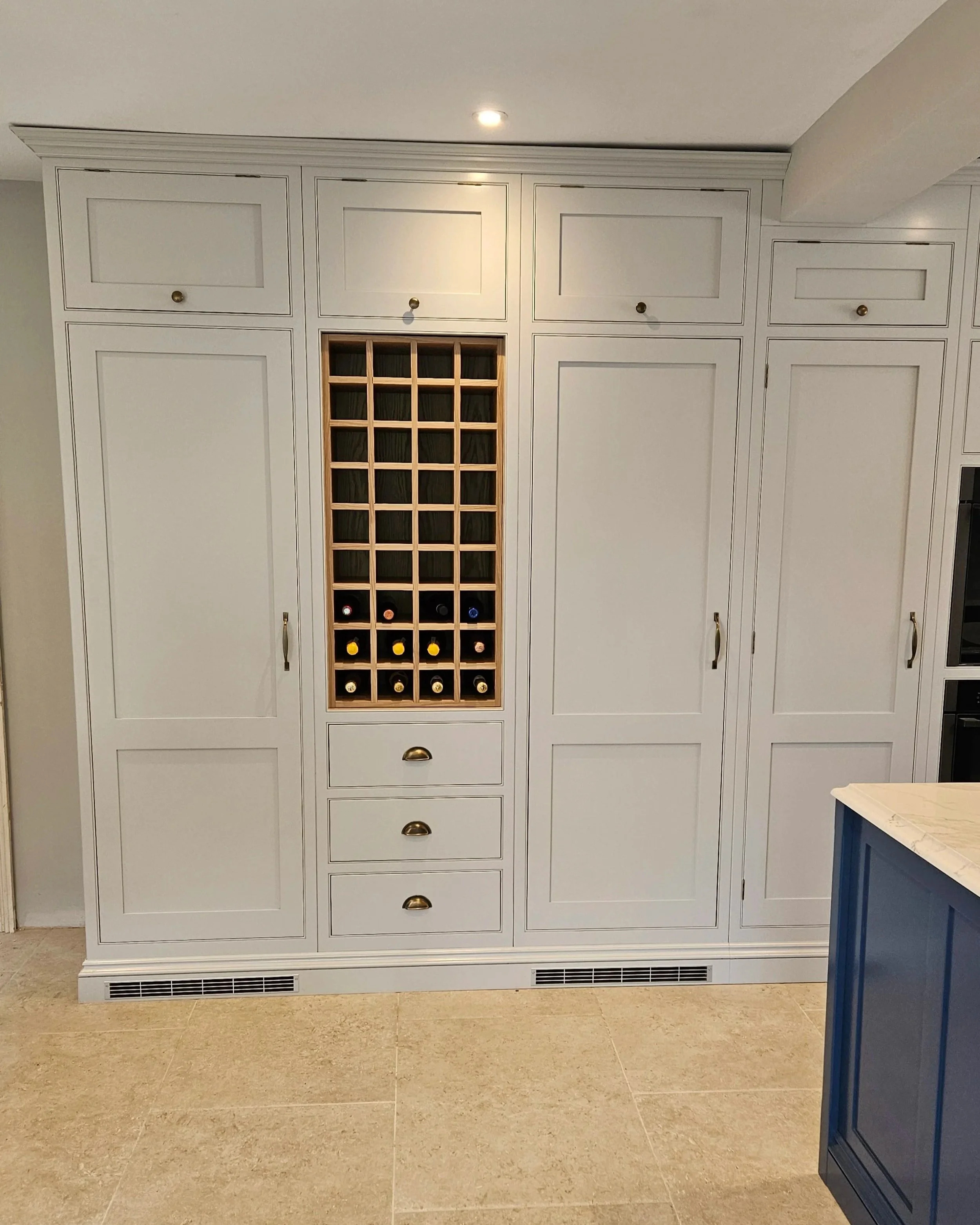 Painted pantry area with Oak wine rack