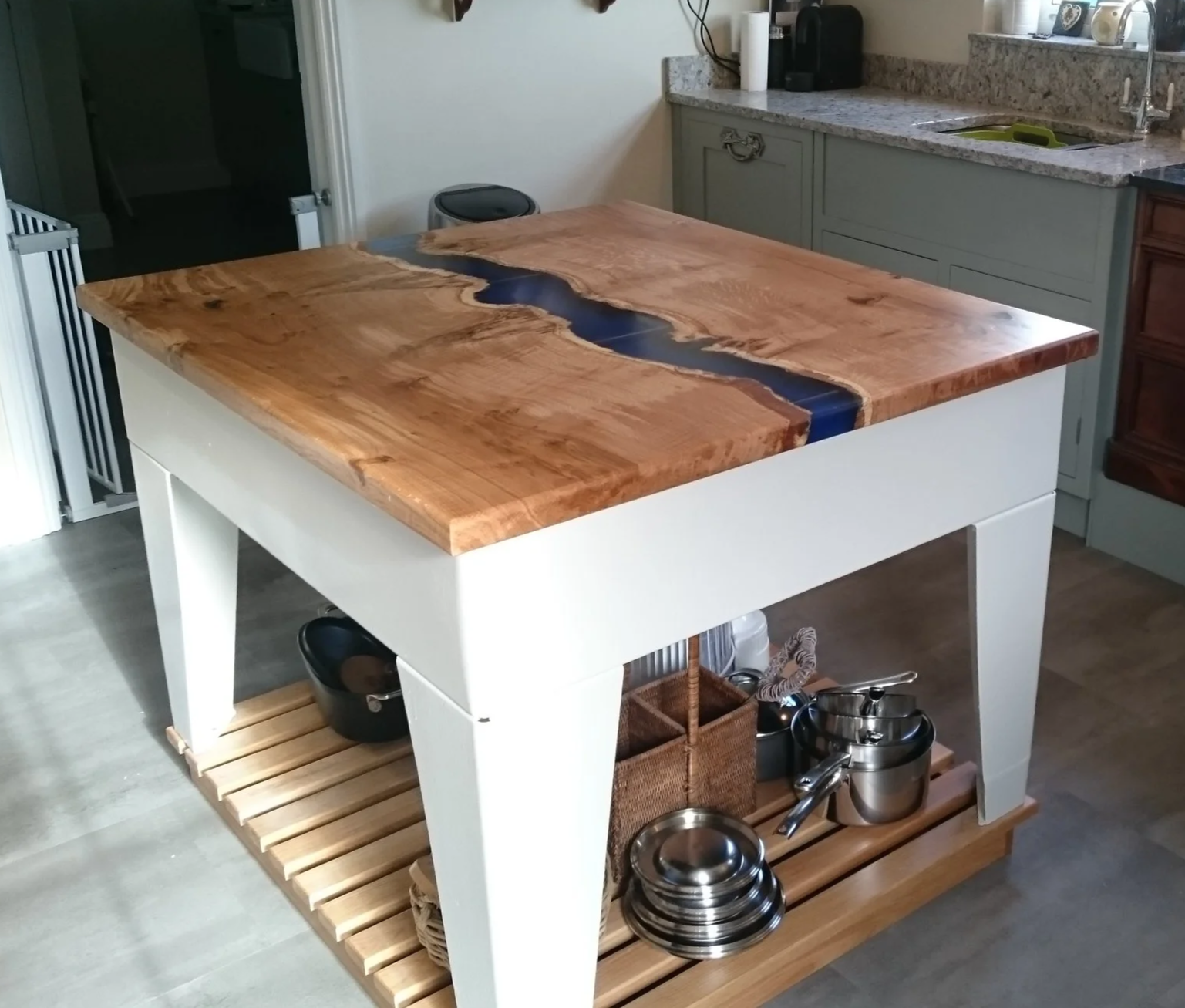 Metal based island with oak and resin river top