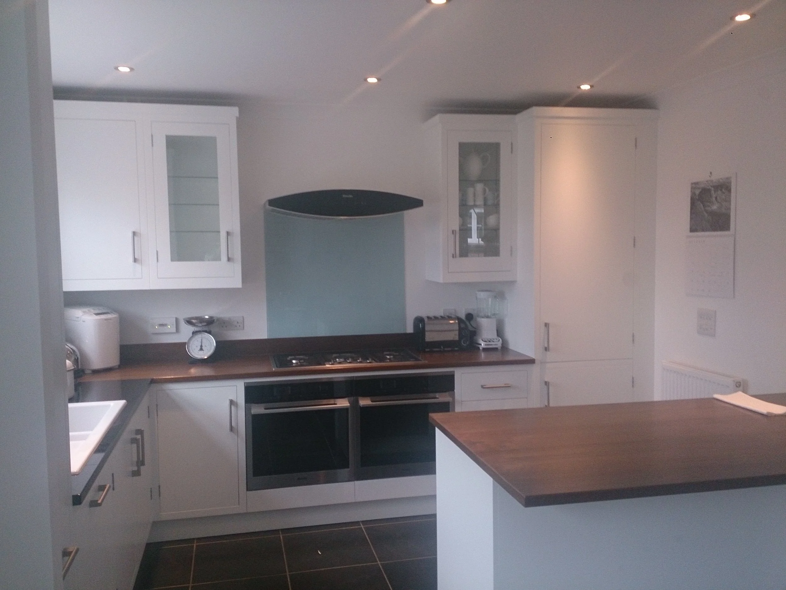 Modern white painted kitchen with Walnut worktops