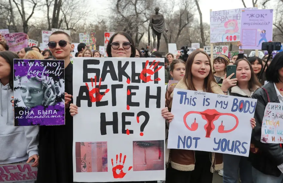 Activists hold a rally to support women's rights on International Women's Day in Almaty, Kazakhstan, March 8, 2023. © 2023 Pavel Mikheyev/Reuters