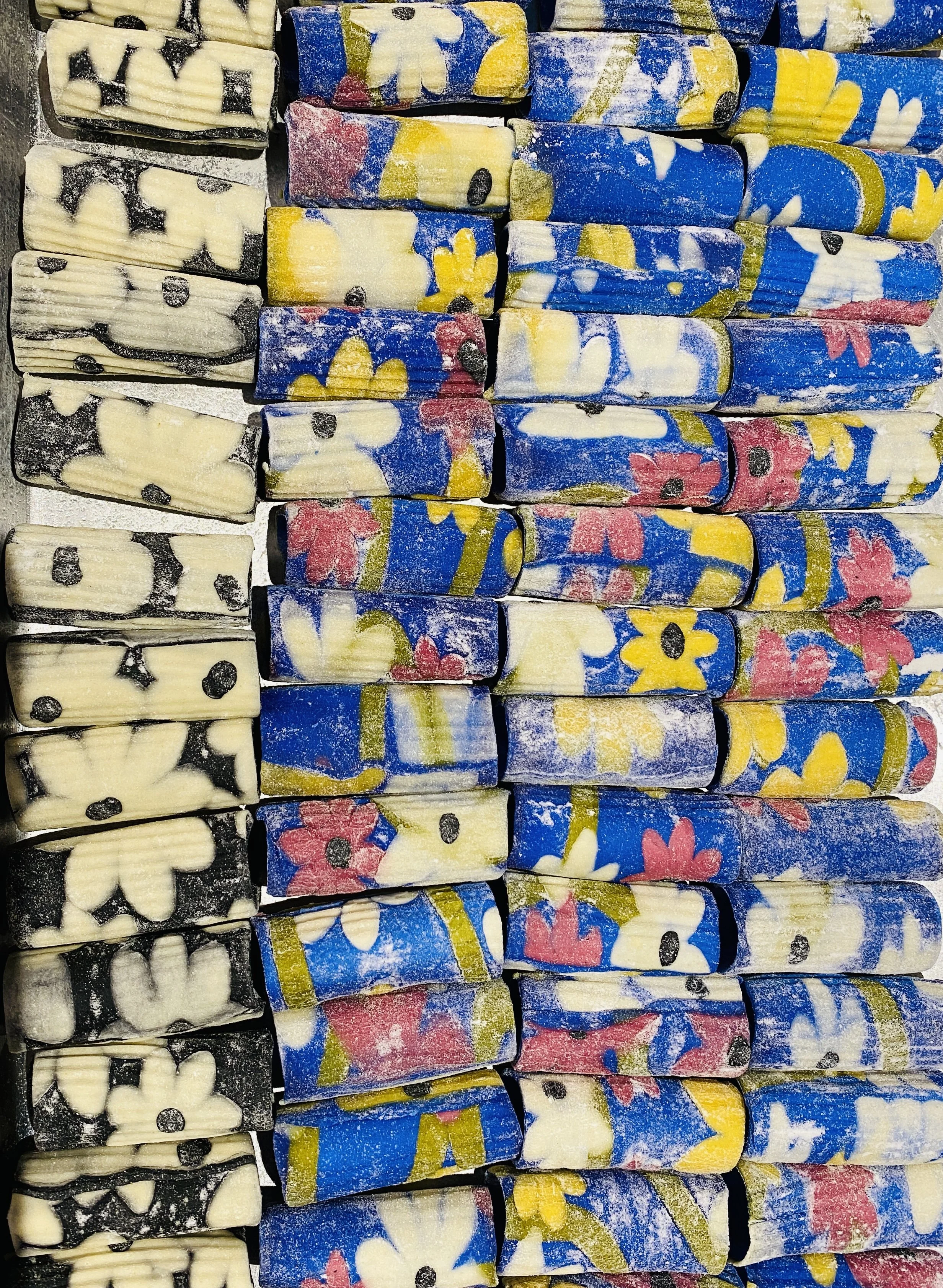 Colored pasta with floral and patterned designs.