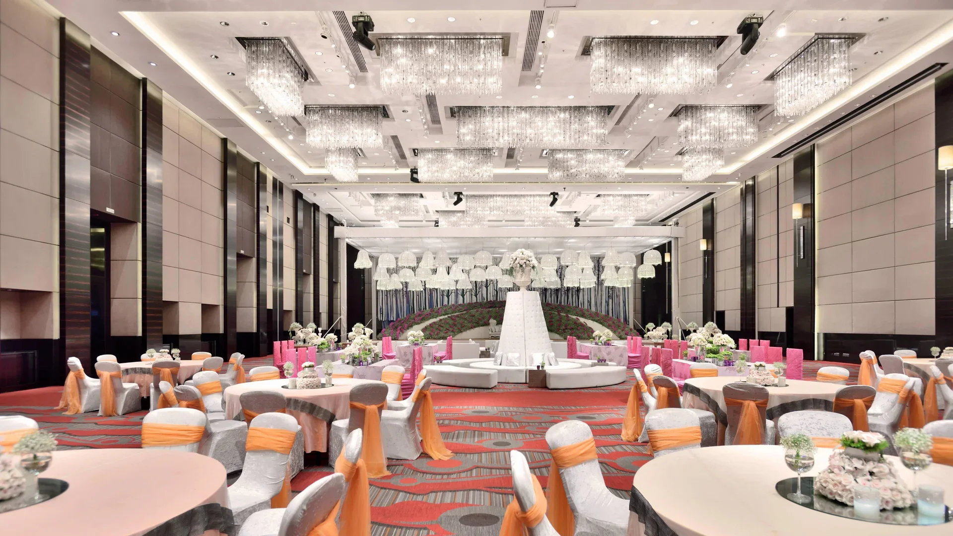 Corporate gala dinner production at The Ritz-Carlton Pune featuring modern LED stage branding.