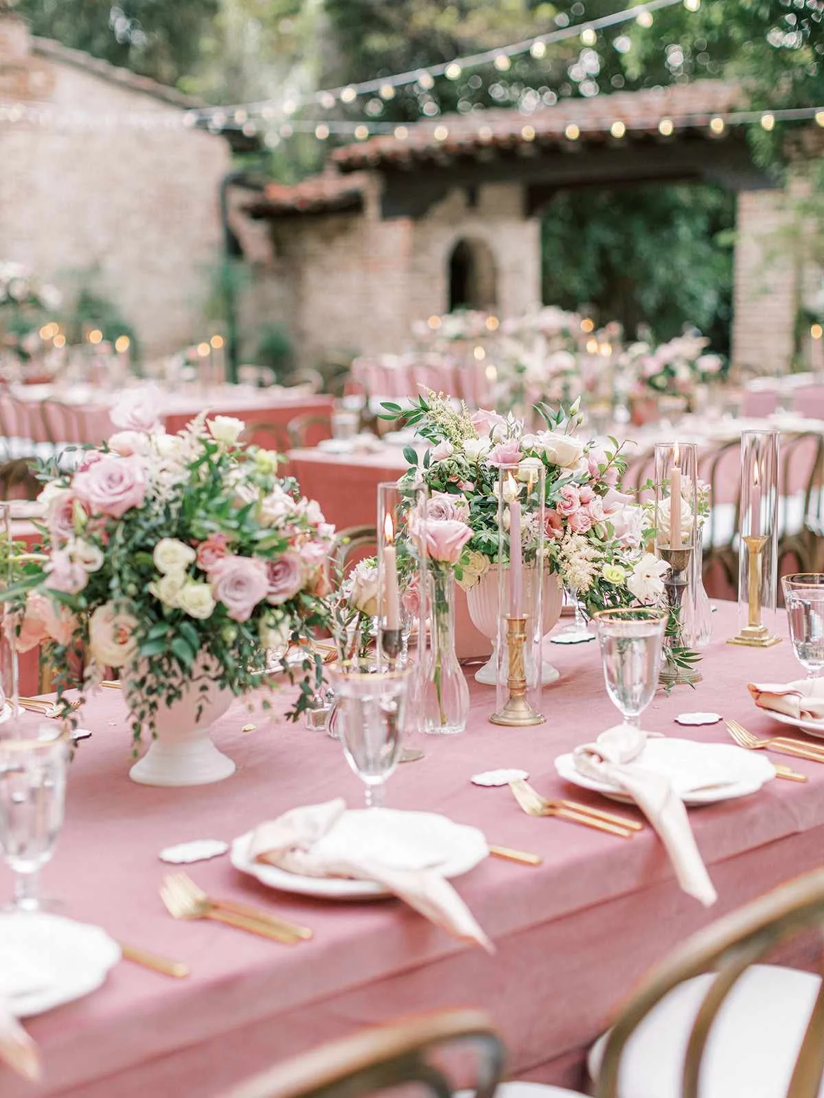 Chic outdoor sundowner social event in Pune featuring fairy lights and boho-style lounge seating.