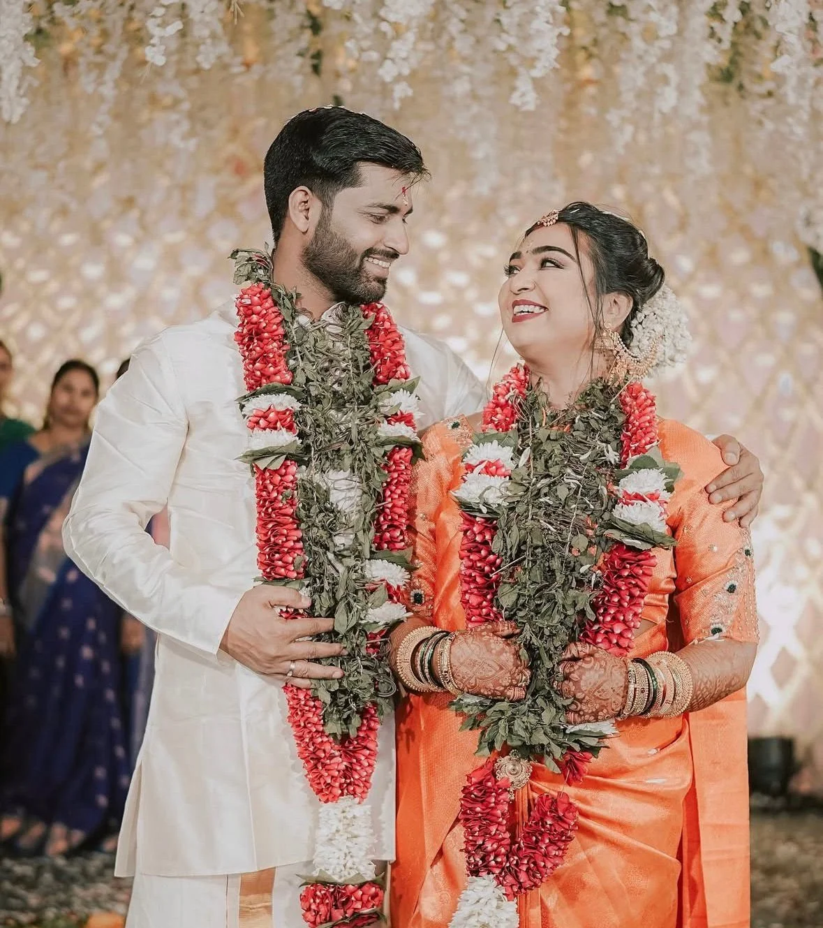 Regal Indian wedding ceremony with a couple at a historic palace venue.