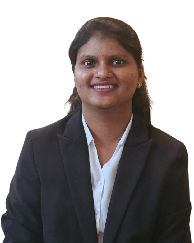 A woman in a professional black blazer and white shirt posing for a photo with a smile. India and Canada