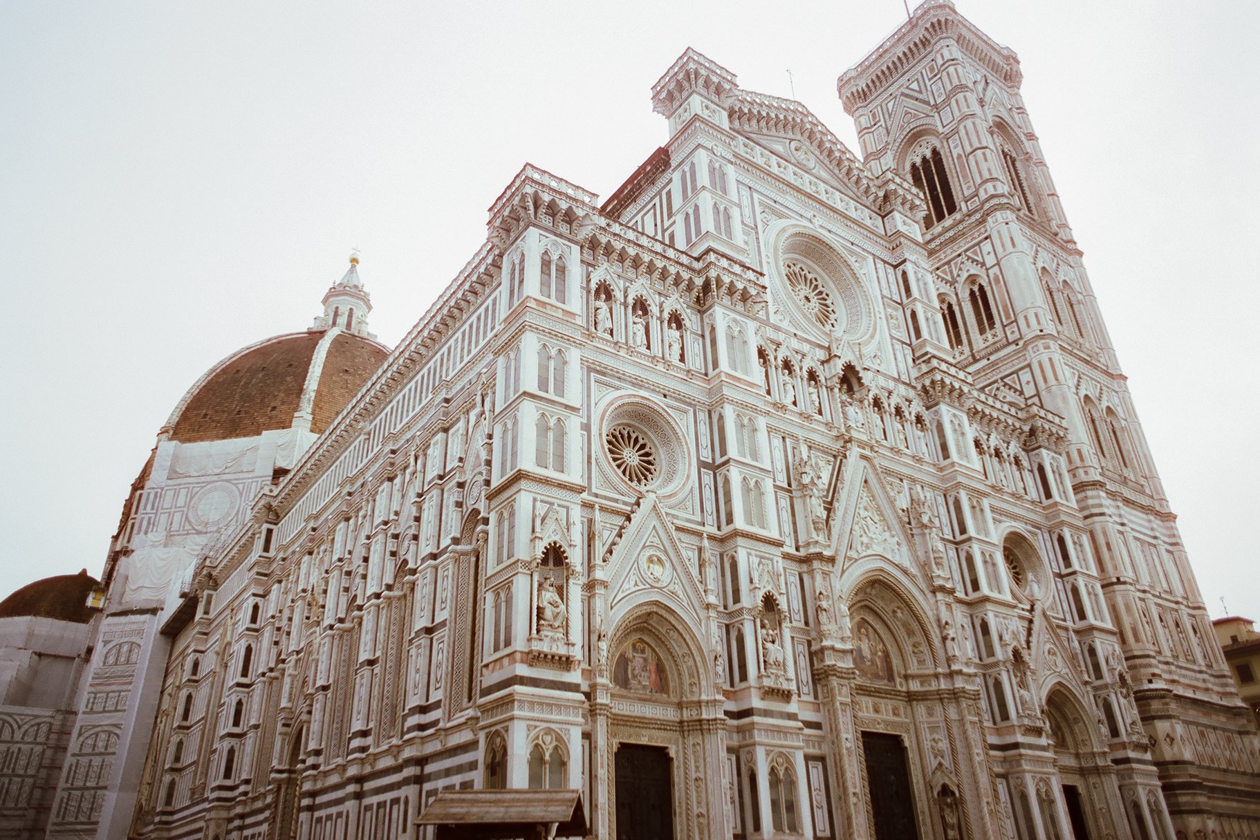 The Florence Cathedral, also known as the Cathedral of Santa Maria del Fiore, with its elaborate marble exterior, dome, and bell tower in Florence, Italy.