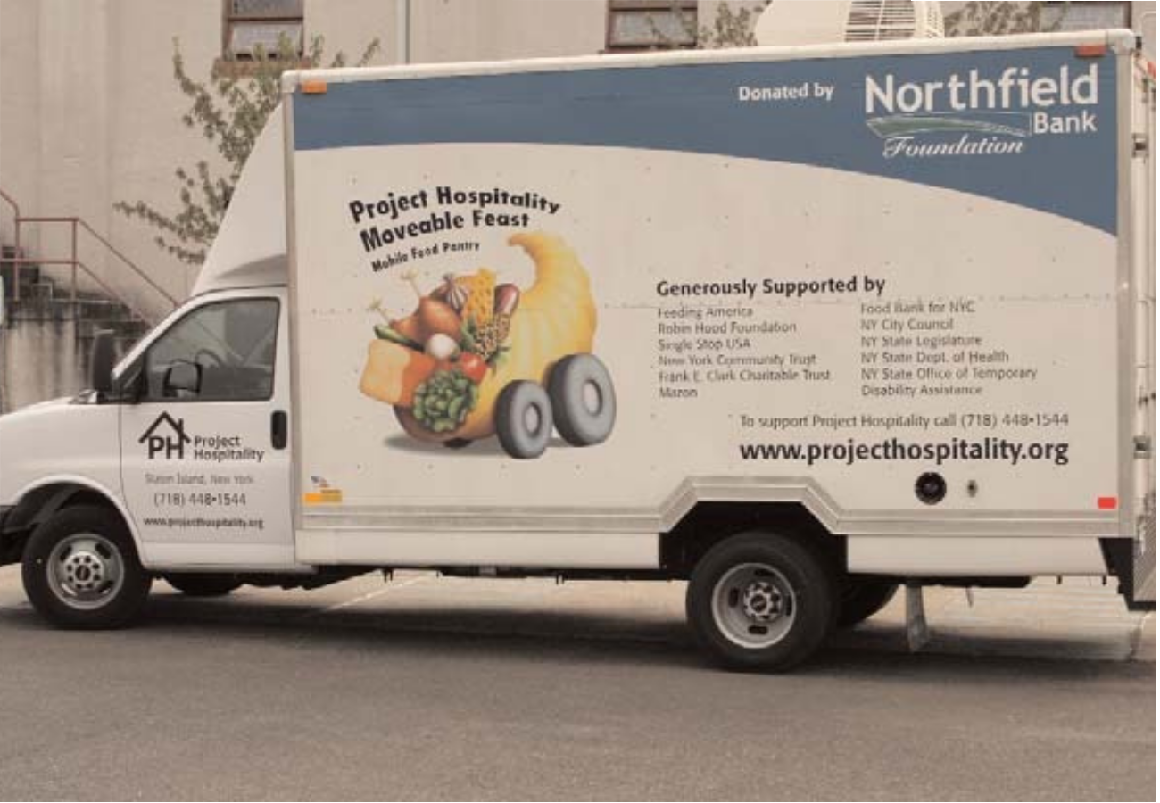 Food truck for Project Hospitality with a graphic of vegetables and a pumpkin, promoting a movable feast event, backed by Northfield Bank Foundation.