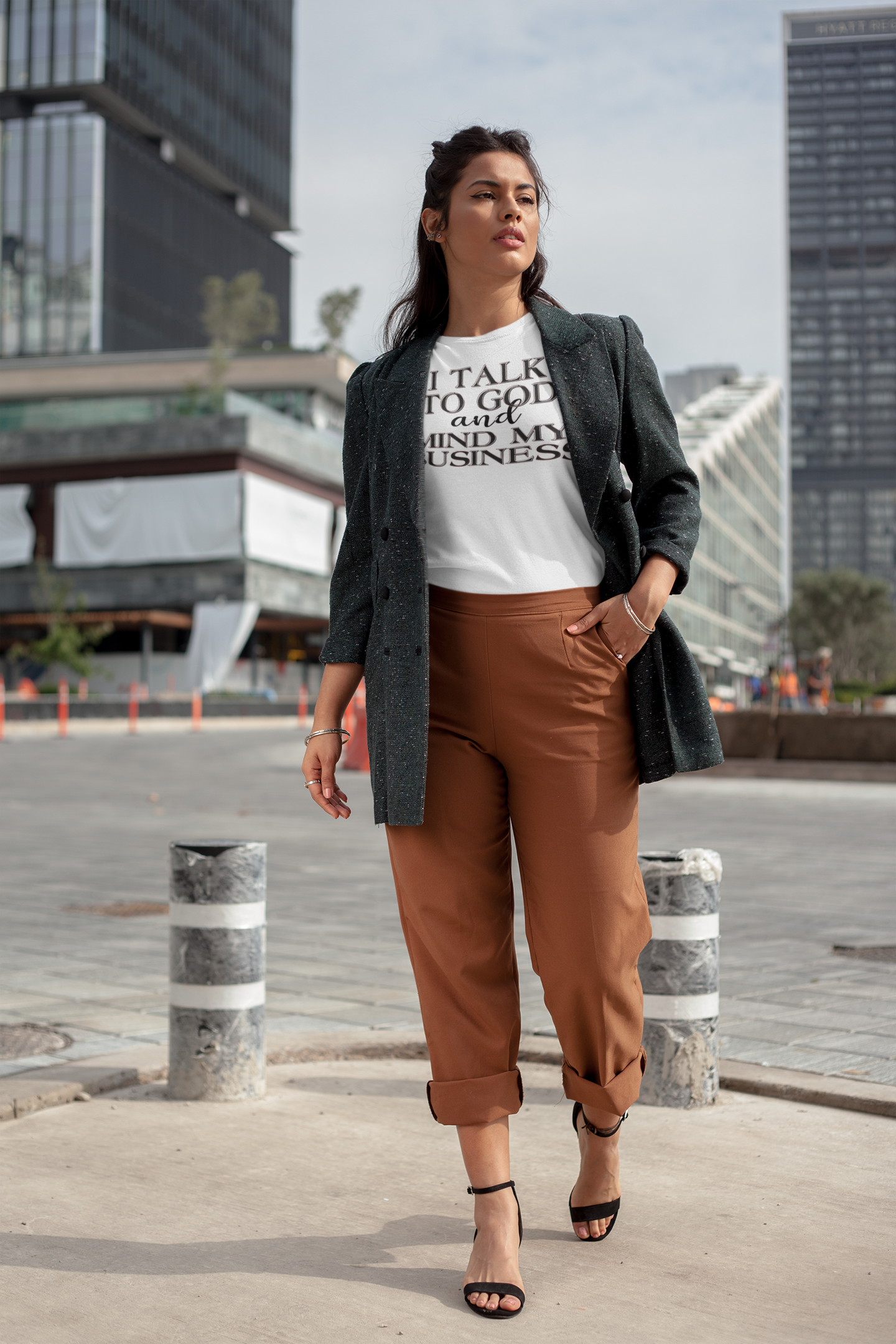 round-neck-tee-mockup-of-a-girl-walking-by-a-financial-center-22685.png