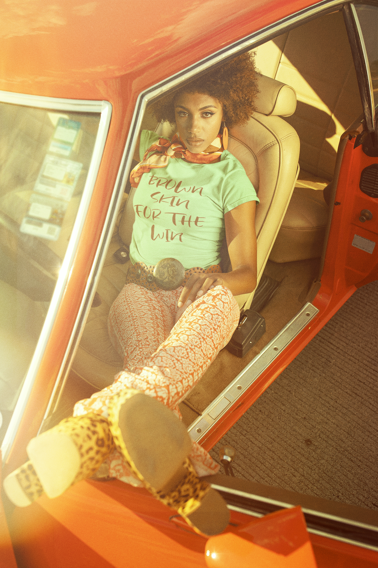 retro-t-shirt-mockup-of-a-woman-sitting-in-the-driver-s-seat-of-a-classic-car-m10510.png