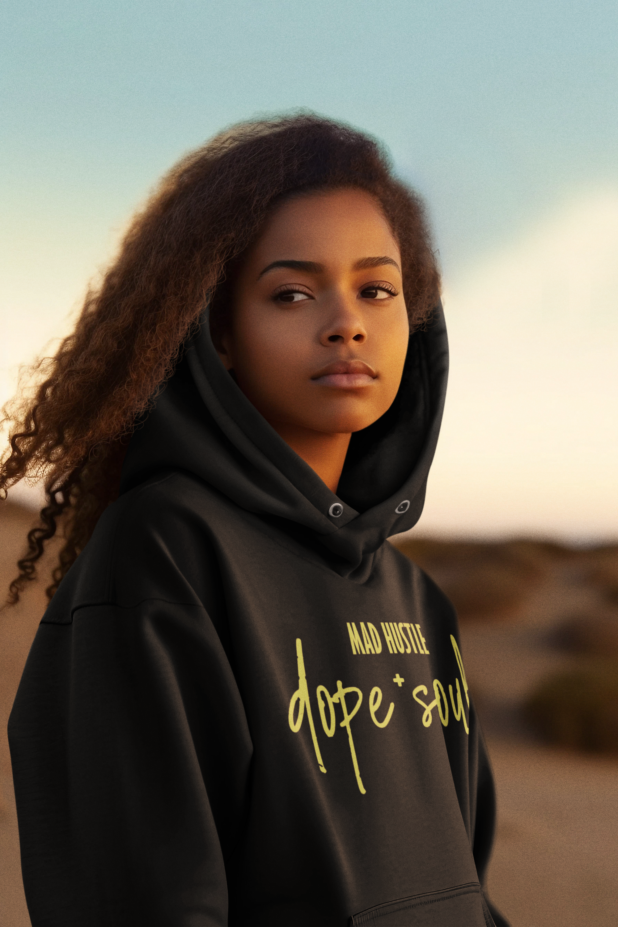 dune-inspired-mockup-featuring-an-ai-generated-woman-wearing-a-pullover-hoodie-m35003.png