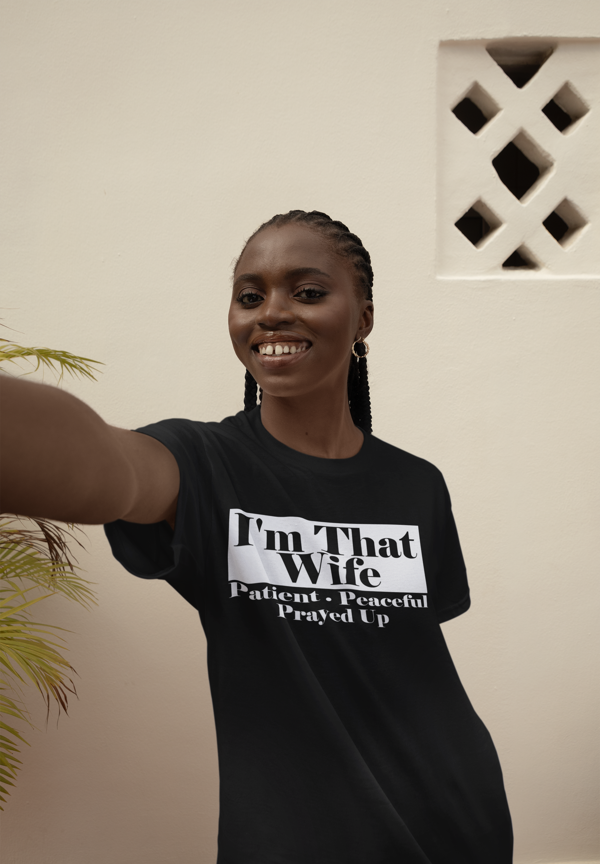 round-neck-t-shirt-mockup-of-a-cheerful-woman-taking-a-selfie-against-a-wall-m37899.png