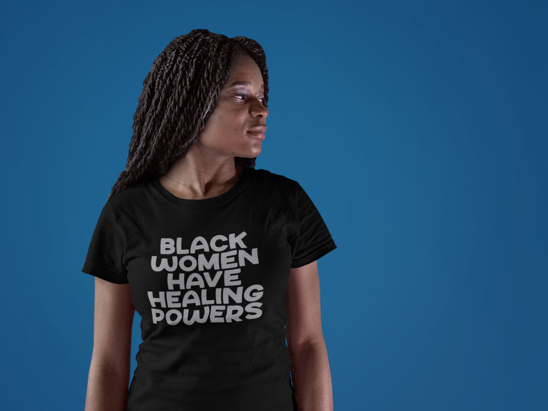mockup-of-a-woman-wearing-a-round-neck-tee-while-standing-against-a-solid-wall-a17196.png