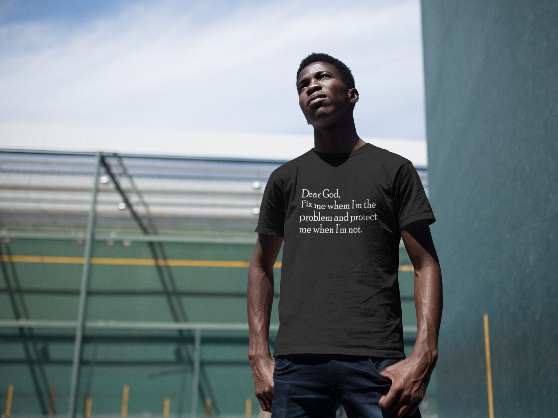 young-man-wearing-a-short-sleeved-t-shirt-while-staring-at-the-sun-in-a-fronton-court-mockup-a14253.png