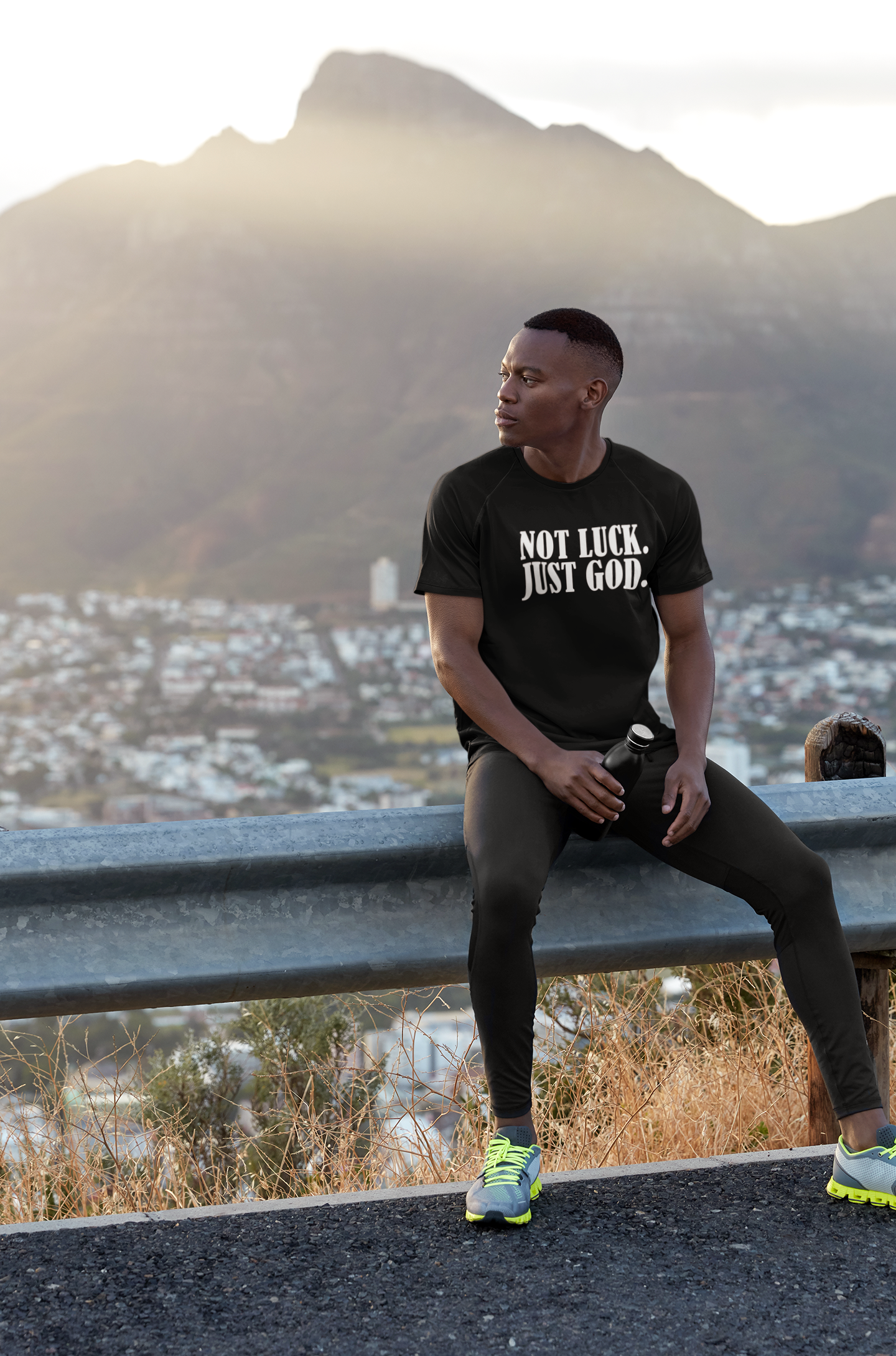 round-neck-t-shirt-mockup-featuring-a-man-sitting-against-a-city-view-m8913-r-el2.png