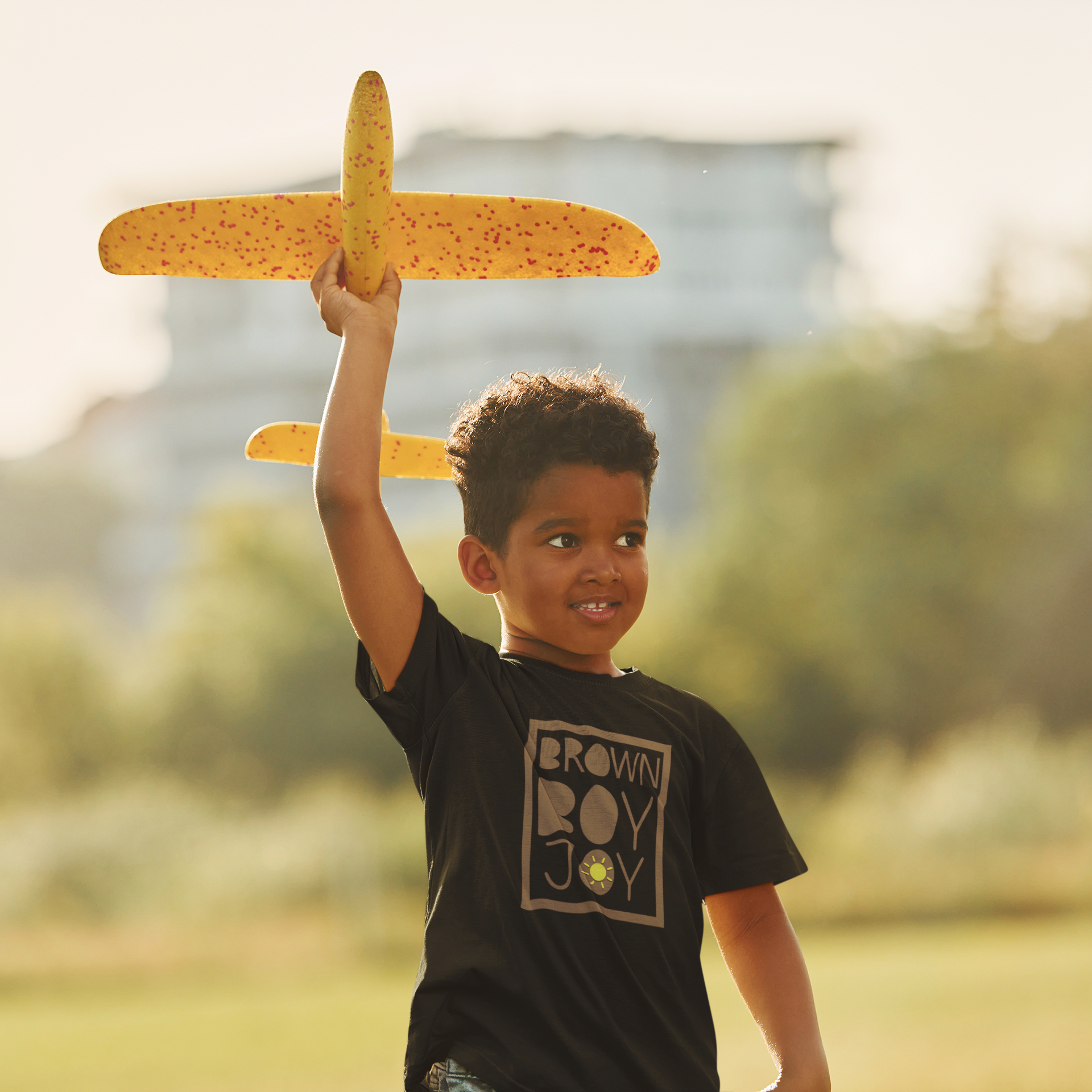t-shirt-mockup-of-a-little-boy-playing-a-toy-plane-m16741-r-el2 (1).png