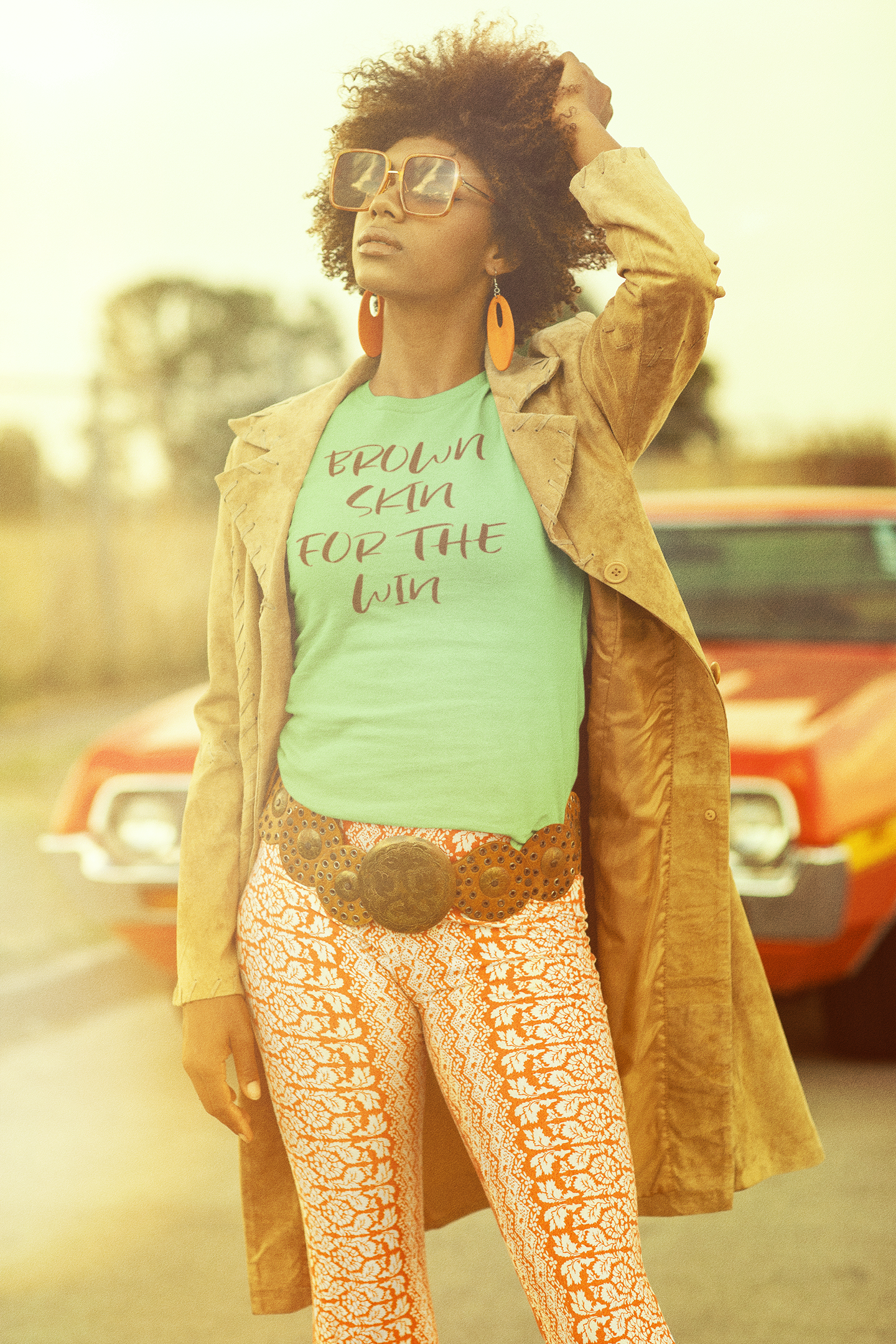 t-shirt-mockup-of-a-curly-hair-woman-posing-near-a-vintage-car-m10512.png