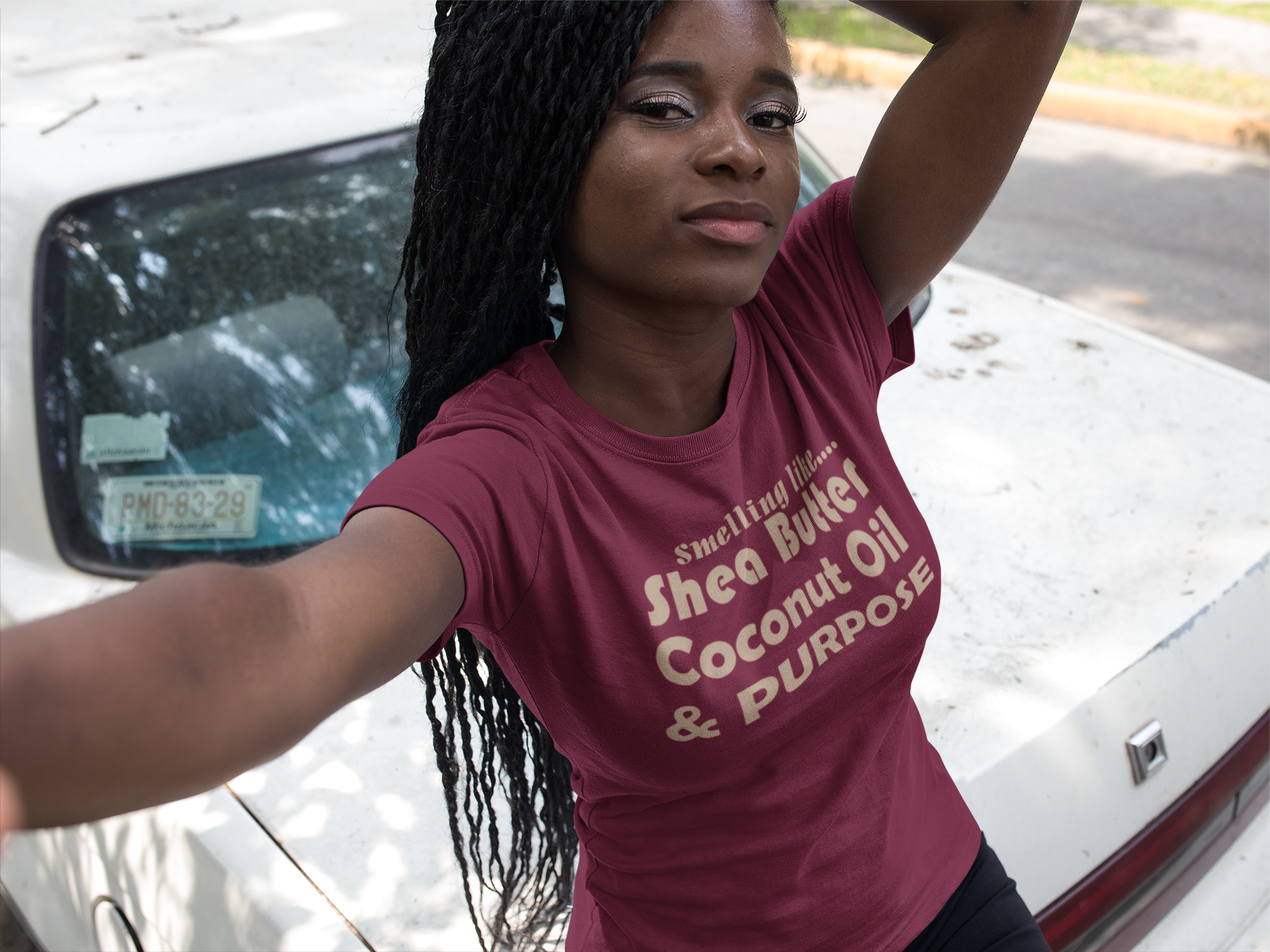 selfie-of-a-pretty-black-girl-with-dreadlocks-wearing-a-round-neck-tee-mockup-next-to-an-old-car-a17187.png