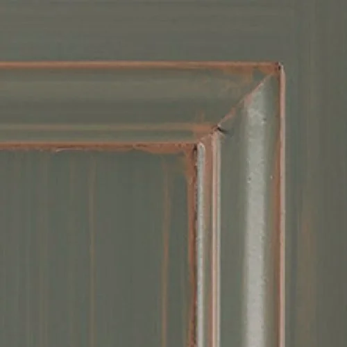 Close-up of a door with a metallic handle and a paneled design.