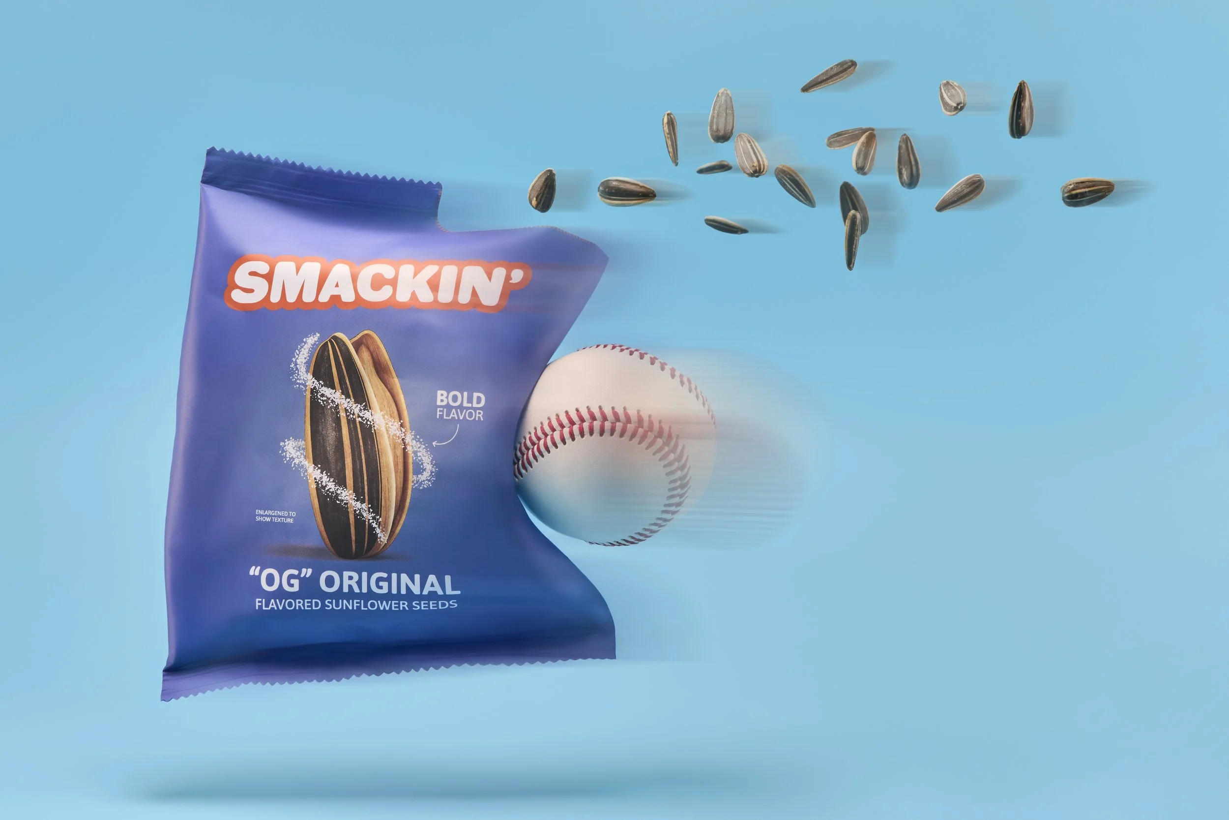 A blue bag of sunflower seeds labeled 'SMACKIN'' and 'OG Original' with sunflower seeds and a baseball on a blue background.