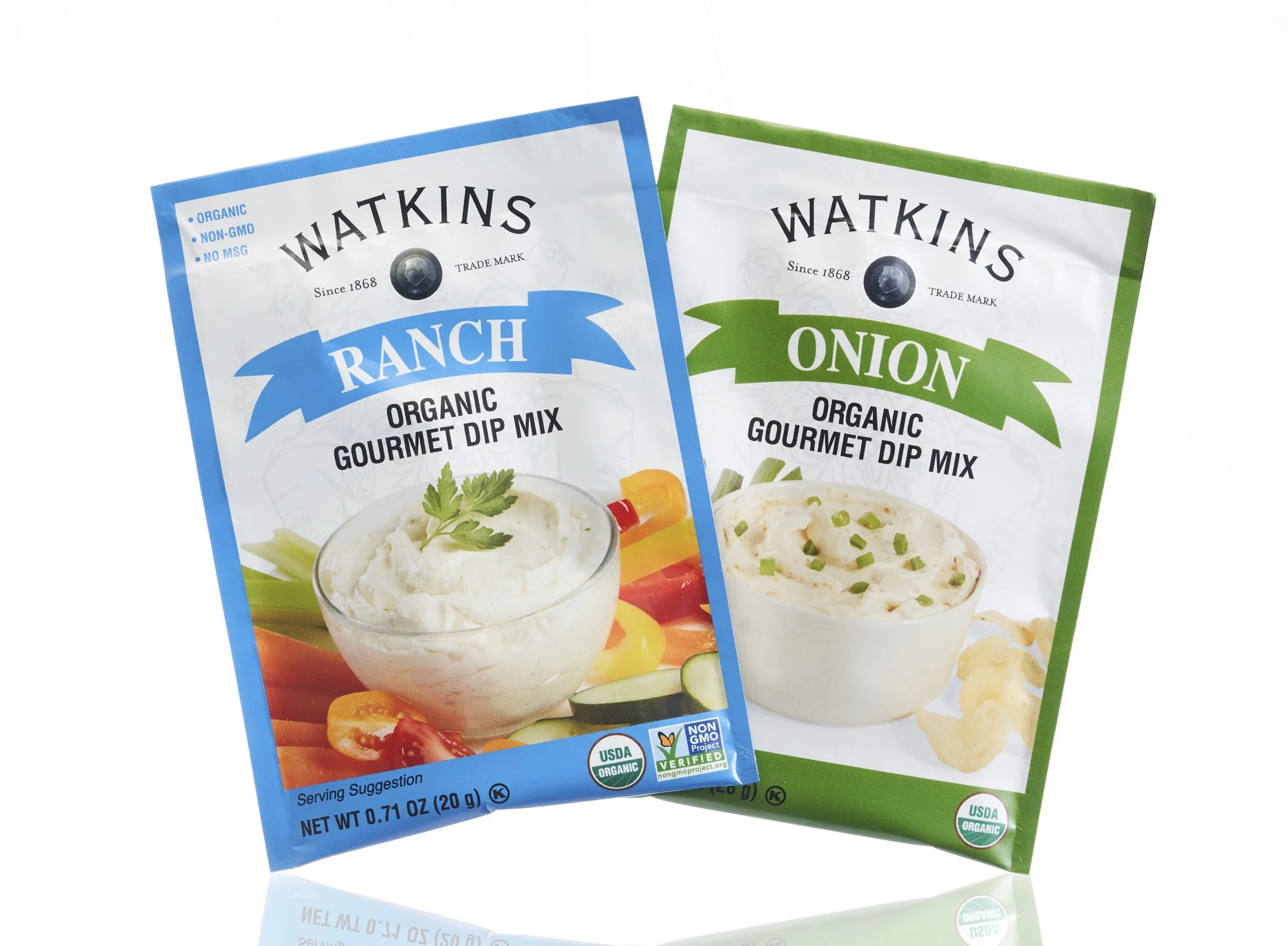 Two packets of Watkins organic gourmet dip mix, one ranch and one onion, with pictures of prepared dips on the front.