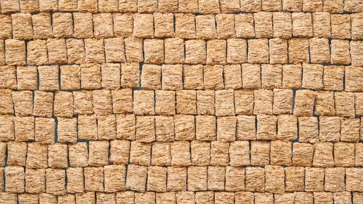 Close-up of a stone brick wall with a grid pattern.