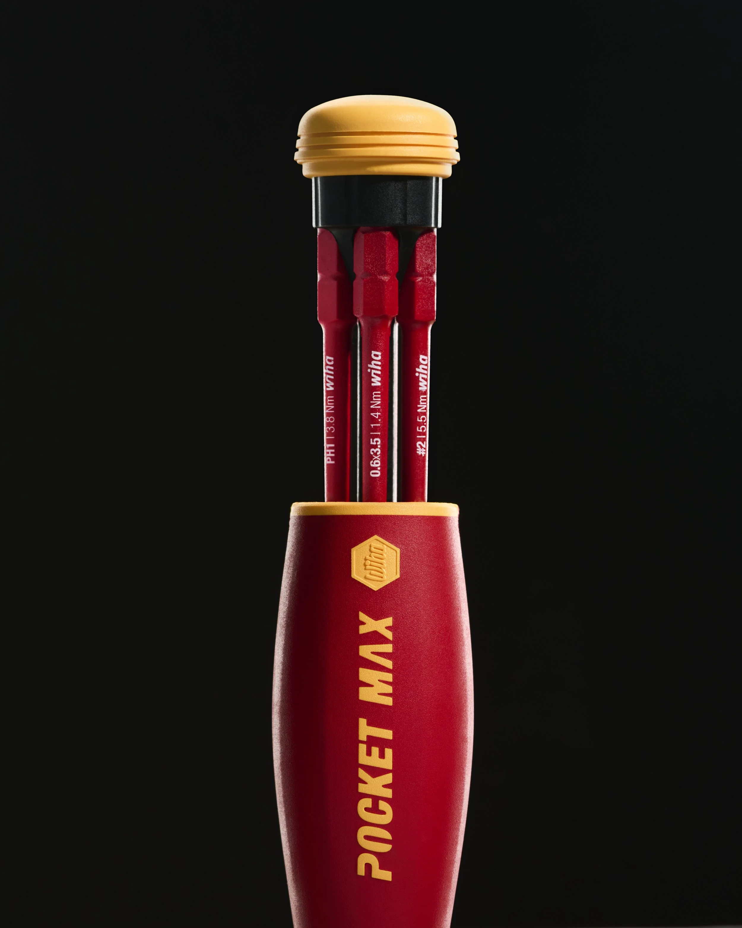 A red screwdriver handle with yellow text reading 'POCKET MAX' and a yellow hexagonal logo, with three red and black precision screwdrivers sticking out of it, set against a black background.