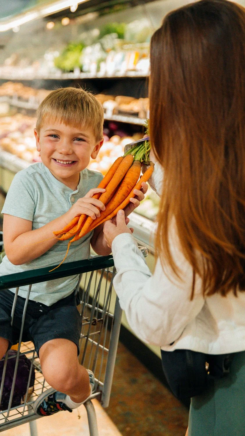 Rollin Oats mom and son shopping at the market